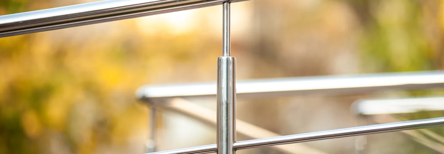 Close up photo of a steel hand railing
