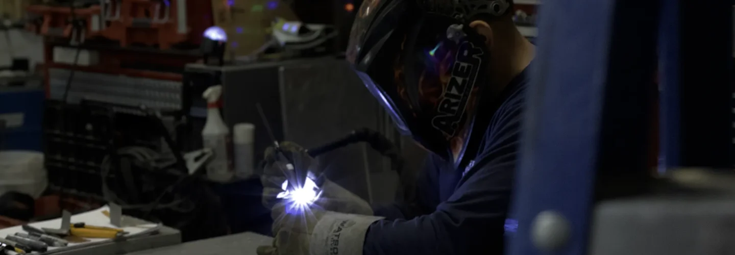 Silver Fern Stainless worker welding in silver fern warehouse